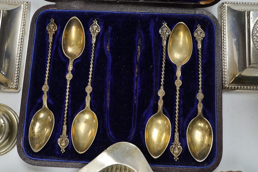 A pair of late Victorian silver dwarf candlesticks, Martin, Hall & Co, Sheffield, 1898, 11.4cm, weighted, a small pair of Irish silver salts, a silver butter shell and six other items including plated ware. Condition - p